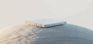 Närbild av en vit kakelplatta med textur, minimalistisk design.